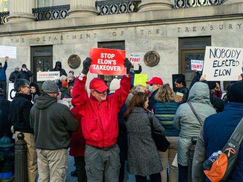 People outside the Treasury Department protesting Musk's actions