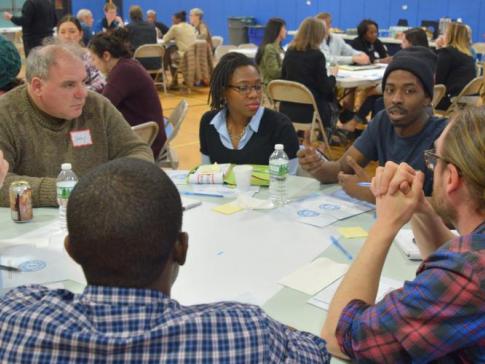 Community members in New Jersey sitting around a table discuss ways to strengthen local journalism.