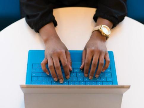 Person typing on laptop. Millions of subscribers to the ACP program are at risk of losing access to high-speed internet.