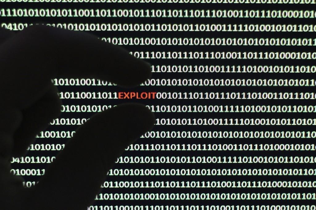 A photograph of a computer screen with the word exploit highlighted