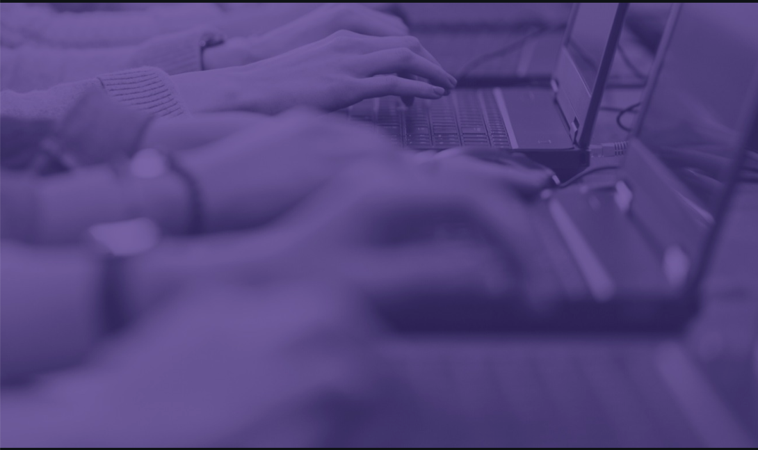 Purple-shaded image of hands typing on laptops