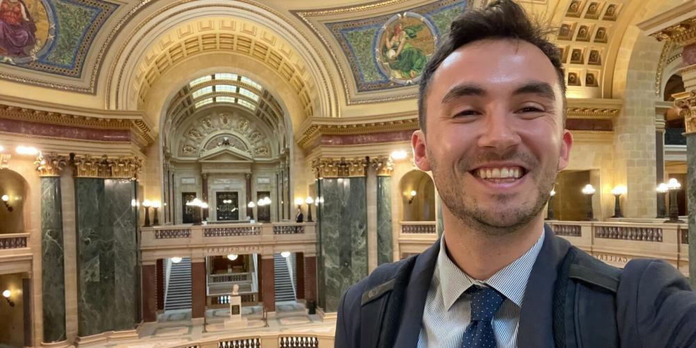 Free Press Action’s Alex Frandsen at the Wisconsin statehouse to celebrate the introduction of legislation designed to strengthen local journalism.