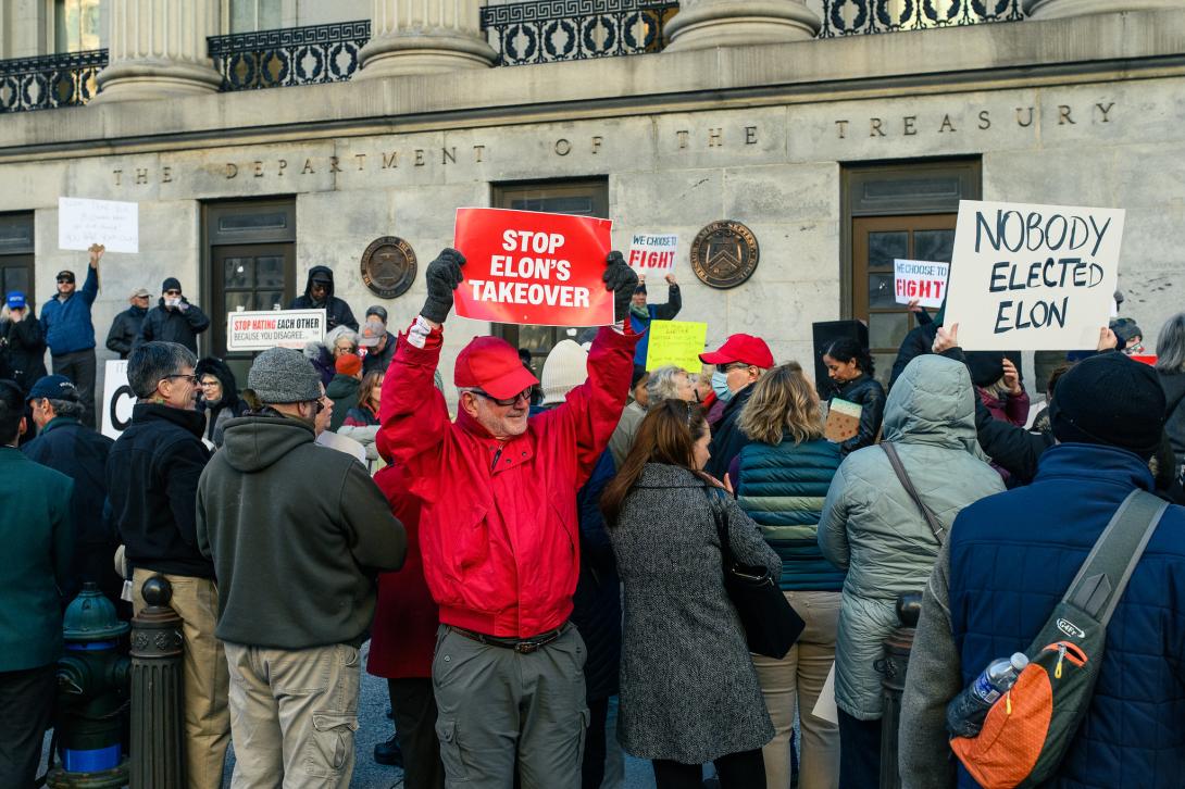 People outside the Treasury Department protesting Musk's actions