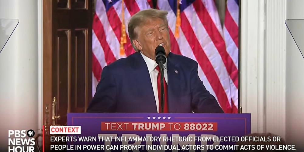 A screenshot of Former President Trump on PBS with added factual context captions