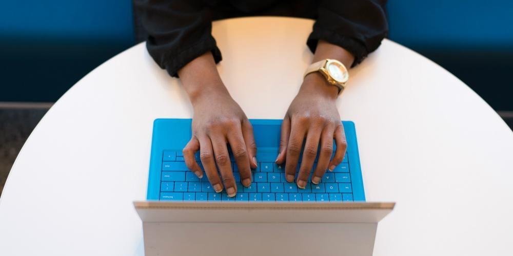 Person typing on laptop. Millions of subscribers to the ACP program are at risk of losing access to high-speed internet.